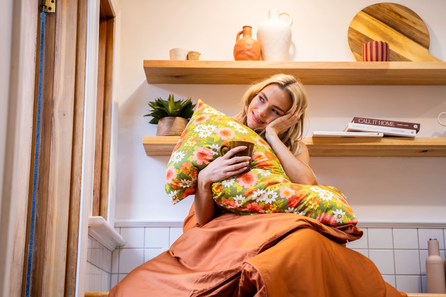 Hazel limited-edition Parlour pillowcase held in a sunlit kitchen