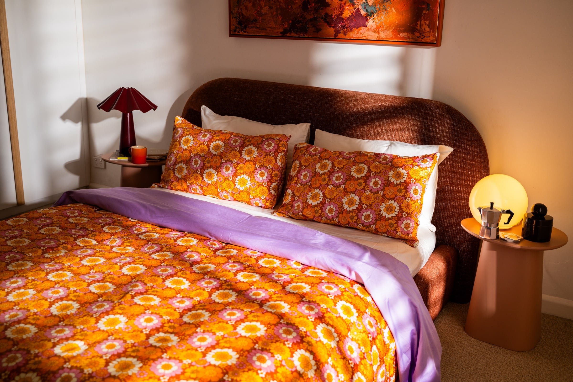 Flower Child quilt and pillowcases layered with Lilac and Cloud cotton