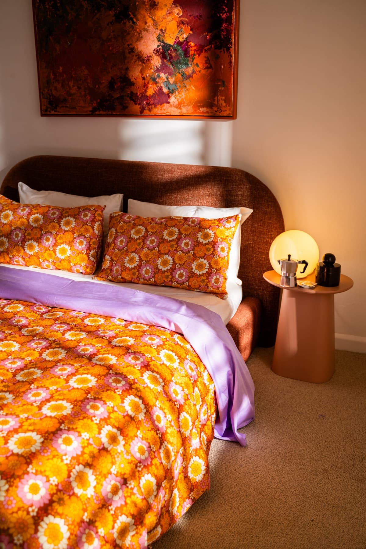Flower Child bedding styled in a warm bedroom