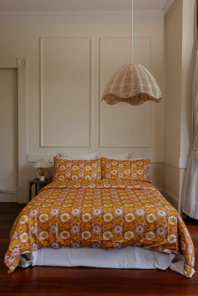 Flower Child cotton bed sheets styled on bed