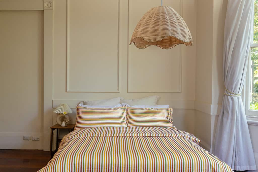 Thelma Stripe quilt cover styled on bed