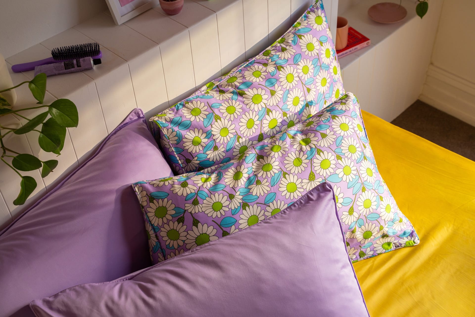Lilac Daisy pillowcases styled with lilac bedding