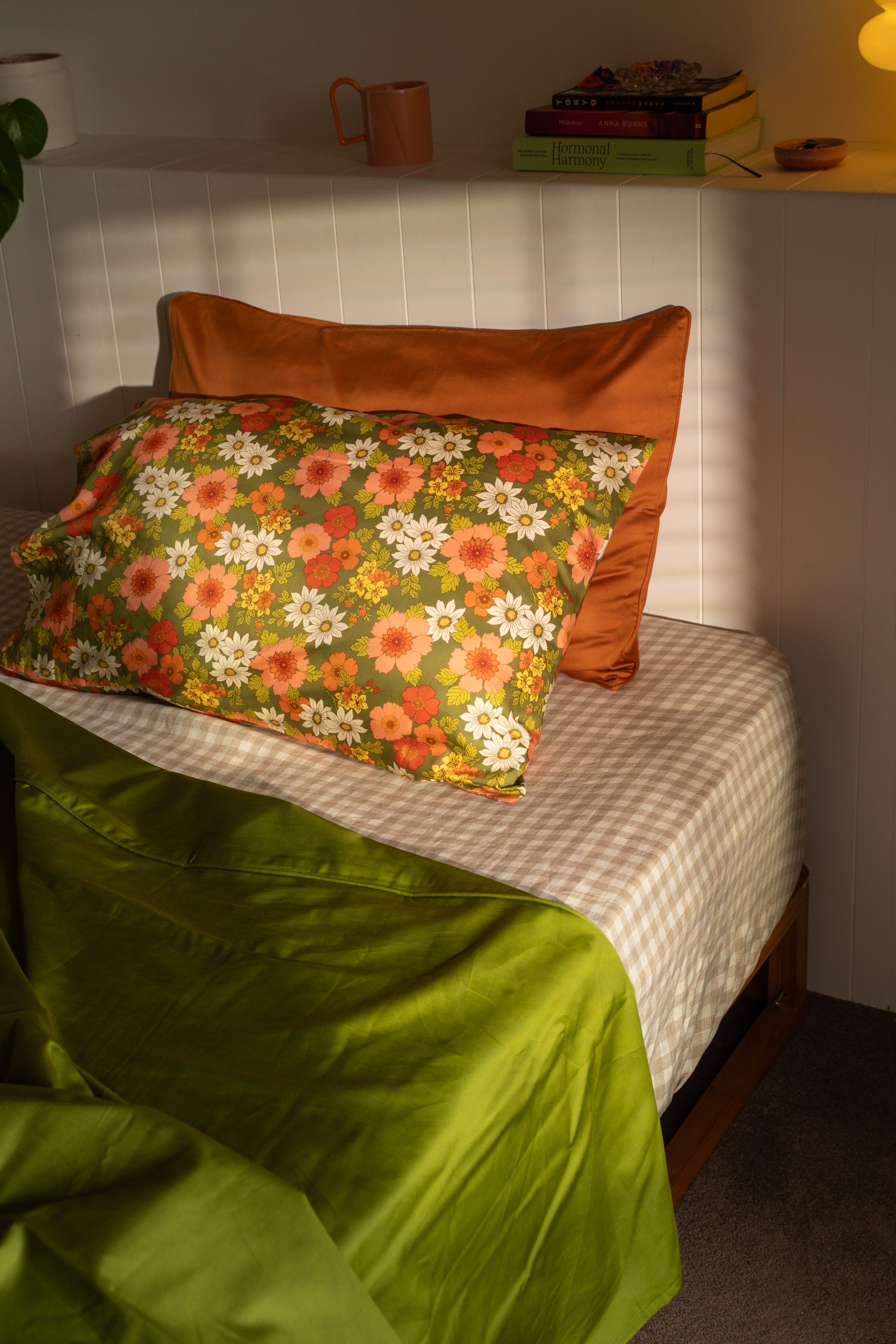 Mamma floral pillowcases styled with rust and green bedding